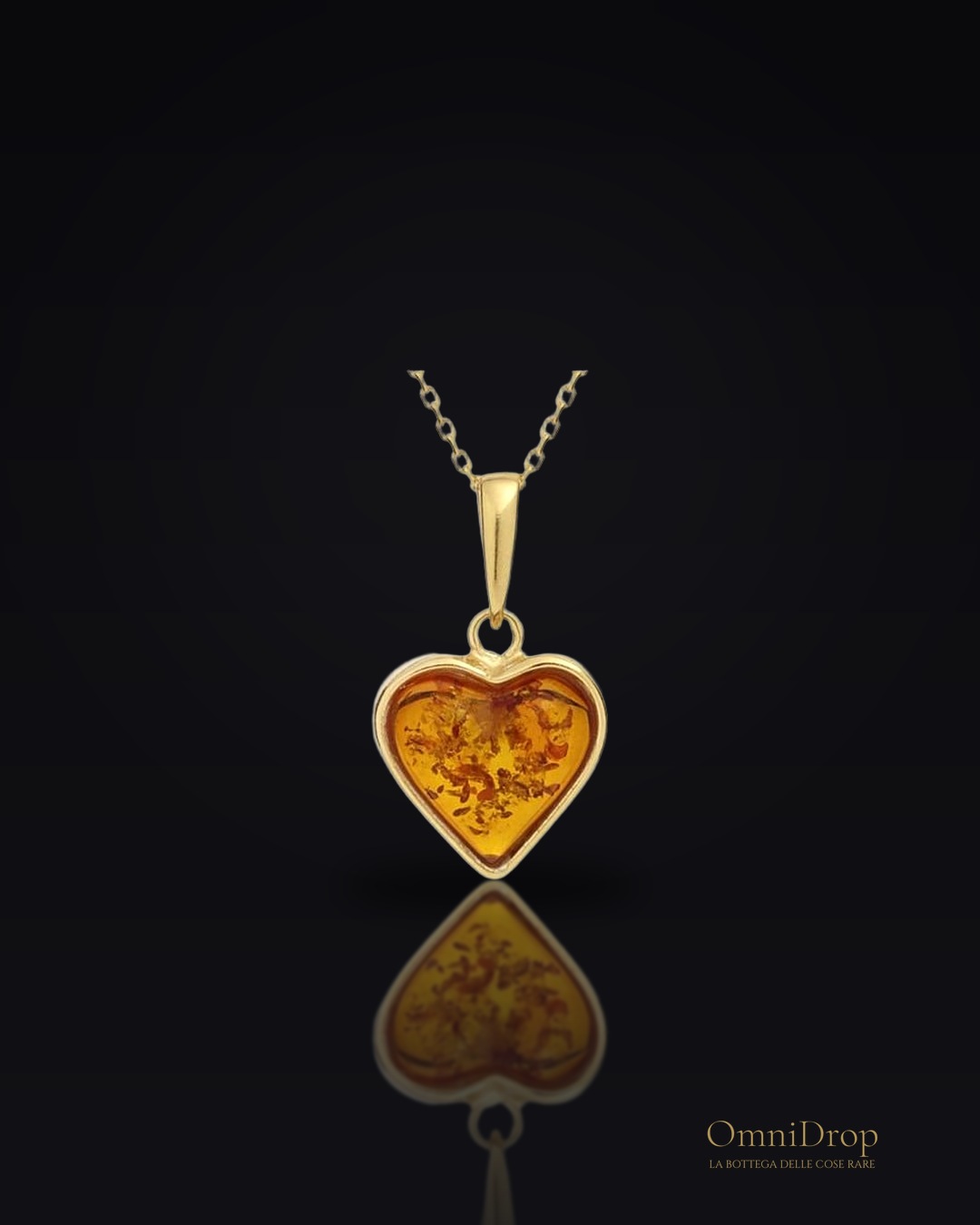 Ciondolo cuore ambra cognac, per portare l'amore