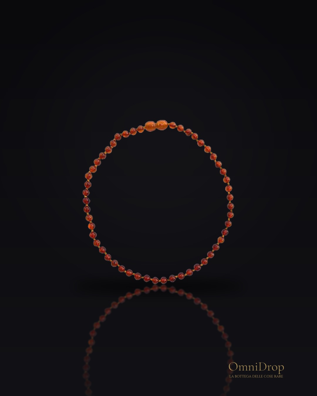 Collana per bambini con sfera d'ambra cognac, protezione e dolcezza