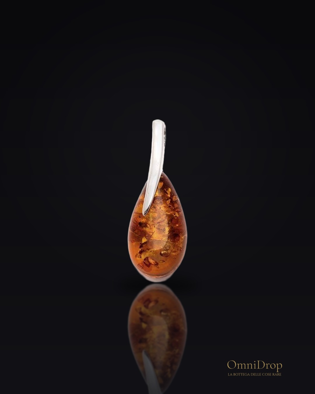 Ciondolo con goccia di ambra cognac, argento 925 rodiato - Per indossare la ricchezza della memoria