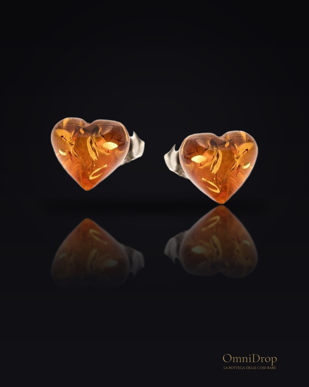 Orecchini a cuore in argento 925 con ambra naturale cognac, per custodire l'amore